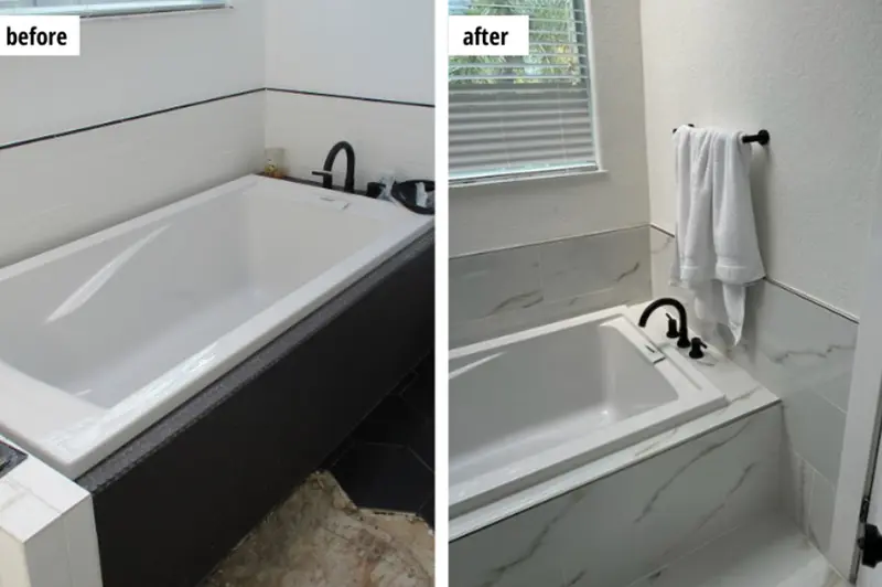 Before and after bathroom bathtub renovation showing a black tub surround replaced with white marble tiles and a towel hanging on a rack.