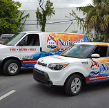 National Restoration Expert vans in a parking lot