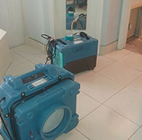 Industrial driers on bathroom floor